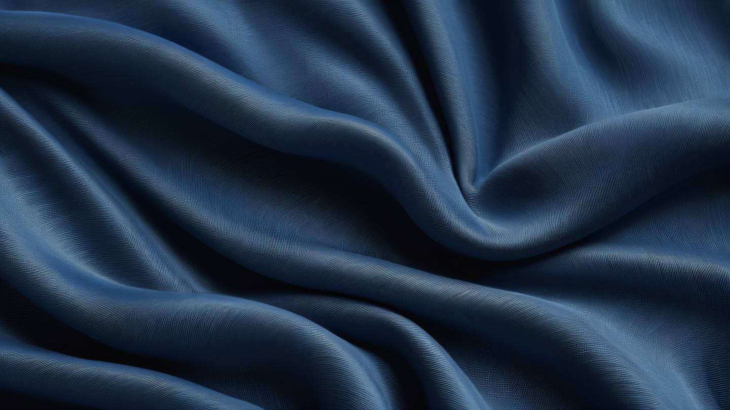 Organic fabric texture with flowing ripples and waves in indigo and zinc colors macro close-up shot from directly above high-quality ultra-realistic cinematic 8K UHD high resolution sharp and detail